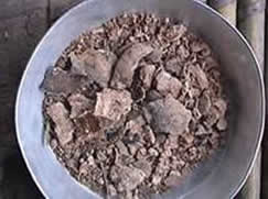 picture of herbal salt which looks like dry red clay